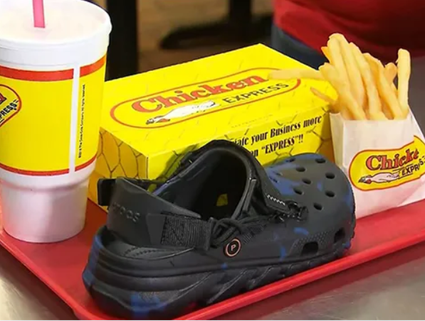 A tray with foods and Crocs from Post Malone (WKRN)