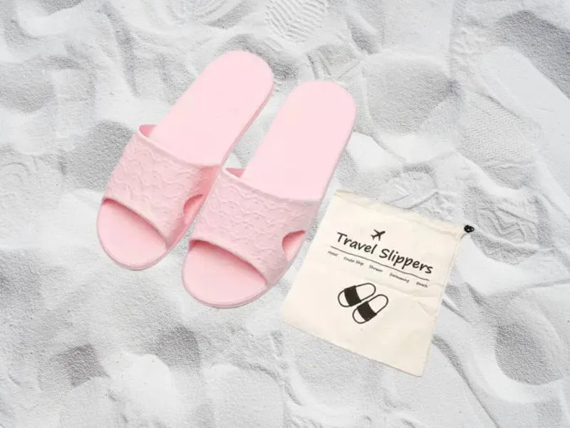 You can use Anmerl Travel Slippers for wearing in shower when traveling