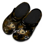 anaheim-ducks-clog-personalized-splatter-splash-gold-black-best-selling.webp