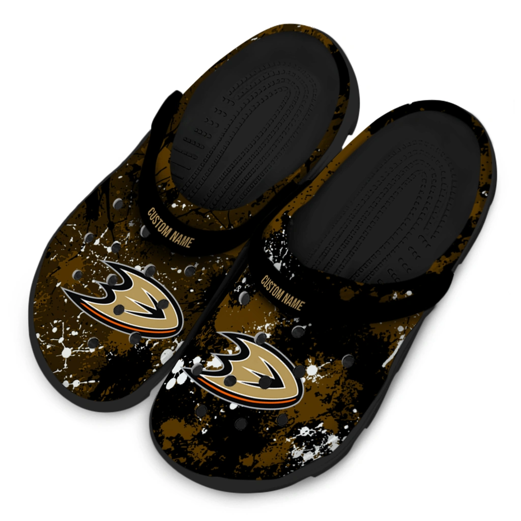 anaheim-ducks-clog-personalized-splatter-splash-gold-black-latest-model.webp